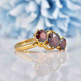 Ellibelle Jewellery Edwardian Almandine Garnet 18ct Gold Three-Stone Bypass Ring