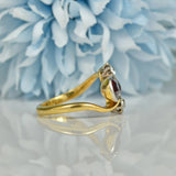 EDWARDIAN GARNET & DIAMOND 18CT GOLD BYPASS RING
