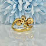 EDWARDIAN GARNET & DIAMOND 18CT GOLD BYPASS RING