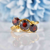 Ellibelle Jewellery Edwardian Almandine Garnet 18ct Gold Three-Stone Bypass Ring