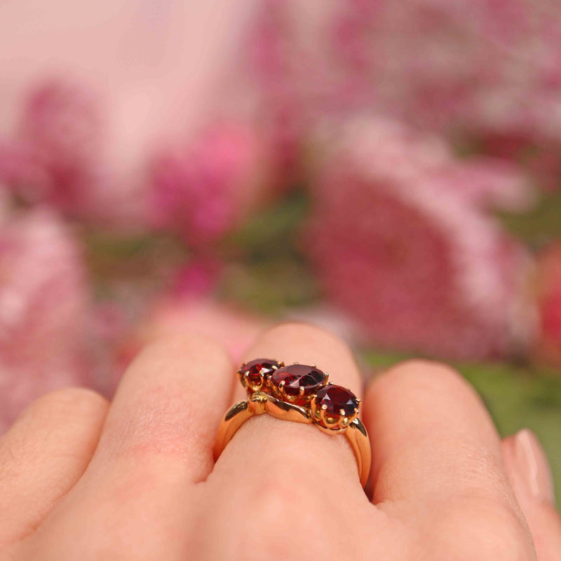 Ellibelle Jewellery Edwardian Almandine Garnet 18ct Gold Three-Stone Bypass Ring