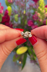EDWARDIAN CUSHION CUT DIAMOND CROSSOVER TRILOGY RING