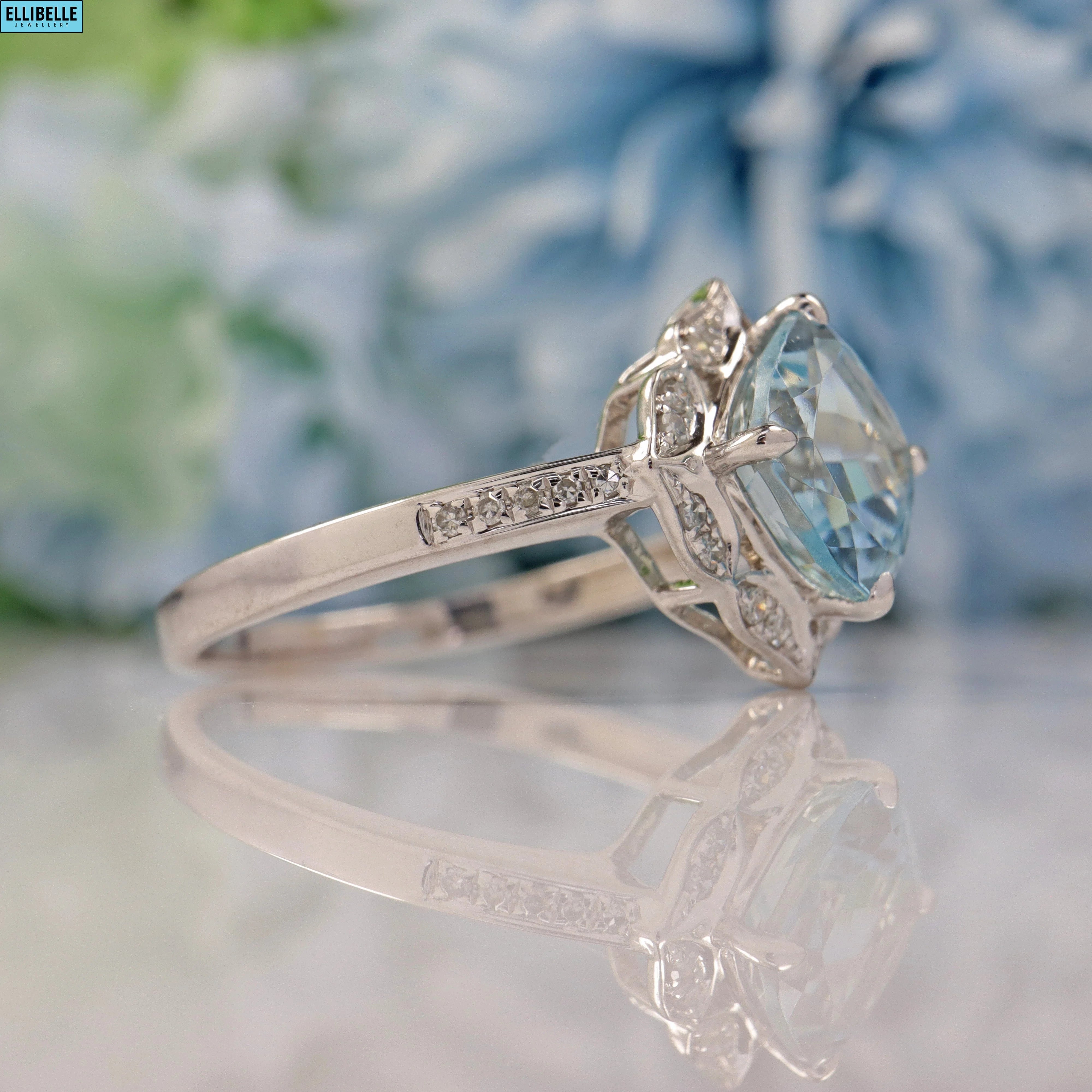 AQUAMARINE & DIAMOND 14CT WHITE GOLD HALO RING