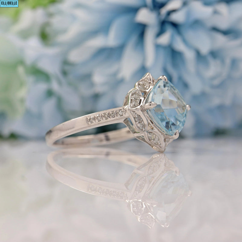 AQUAMARINE & DIAMOND 14CT WHITE GOLD HALO RING