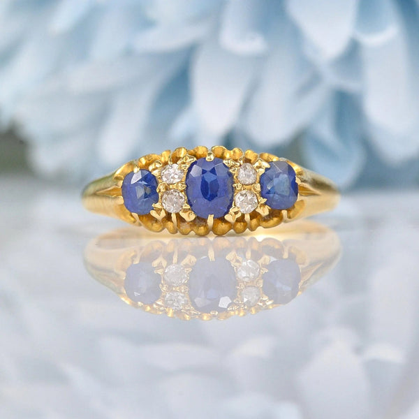 EDWARDIAN SAPPHIRE & DIAMOND 18CT GOLD THREE-STONE RING