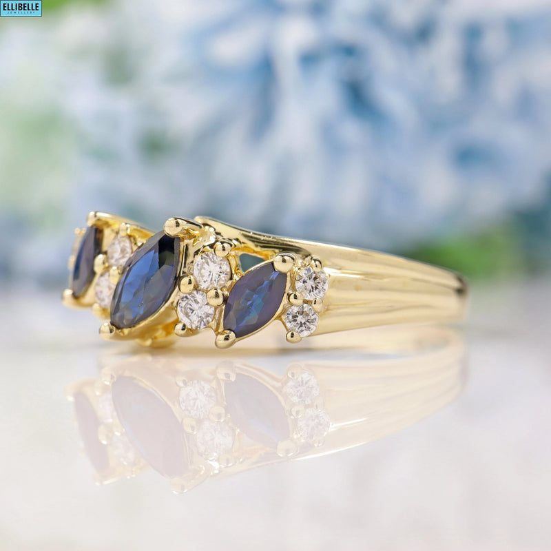 SAPPHIRE & DIAMOND 9CT GOLD MARQUISE BAND RING