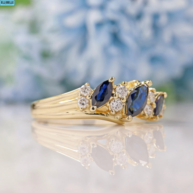 SAPPHIRE & DIAMOND 9CT GOLD MARQUISE BAND RING