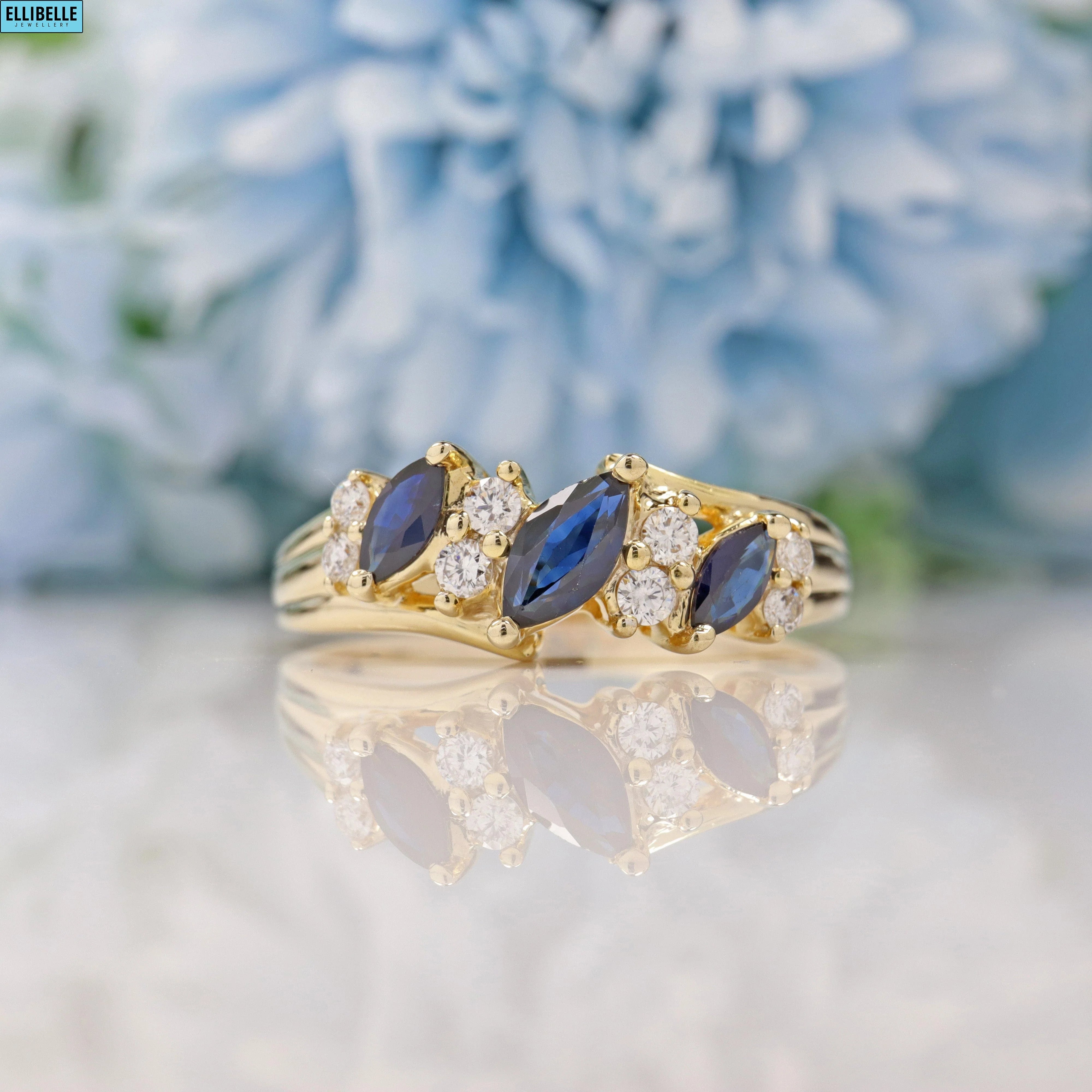 SAPPHIRE & DIAMOND 9CT GOLD MARQUISE BAND RING