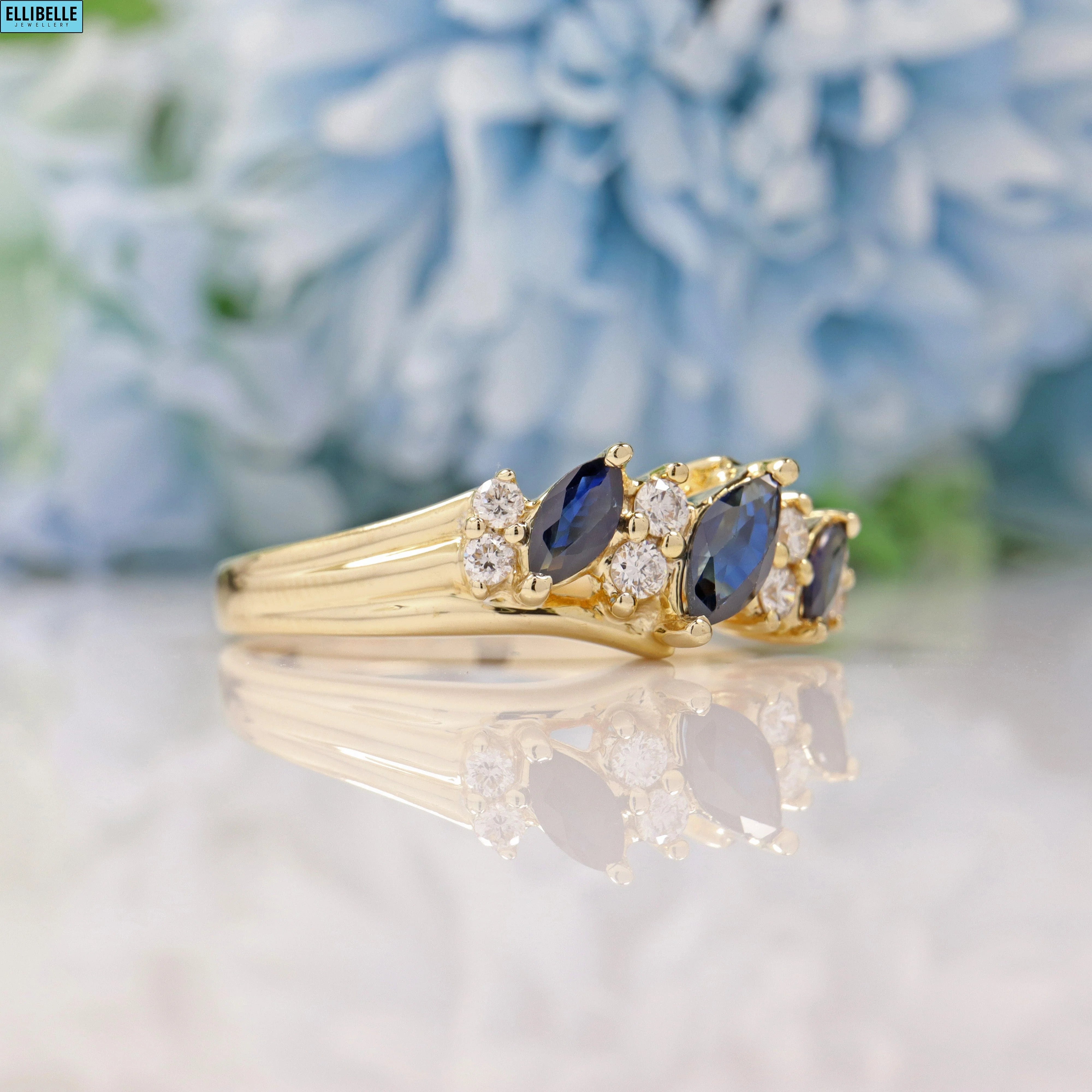 SAPPHIRE & DIAMOND 9CT GOLD MARQUISE BAND RING