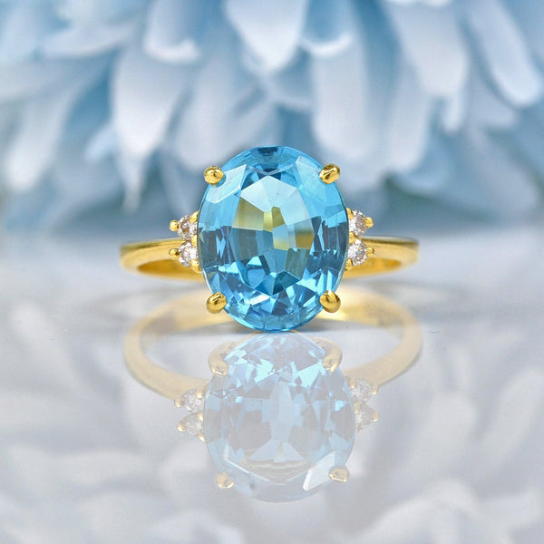 TOPAZ & DIAMOND 18CT GOLD SOLITAIRE RING