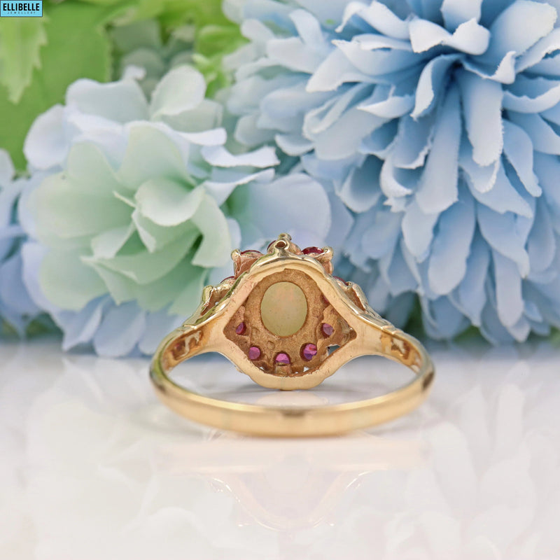 VINTAGE RUBY & OPAL 9CT GOLD HALO CLUSTER RING